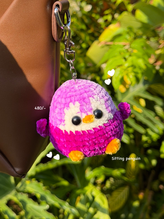 Sitting penguin handmade crochet keychain in India (purple)