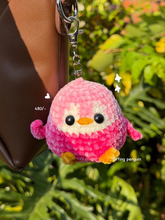 Sitting penguin handmade crochet keychain in India (pink)